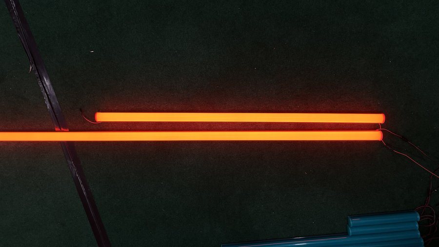 Orange/amber line effect on fascia / building edge at night