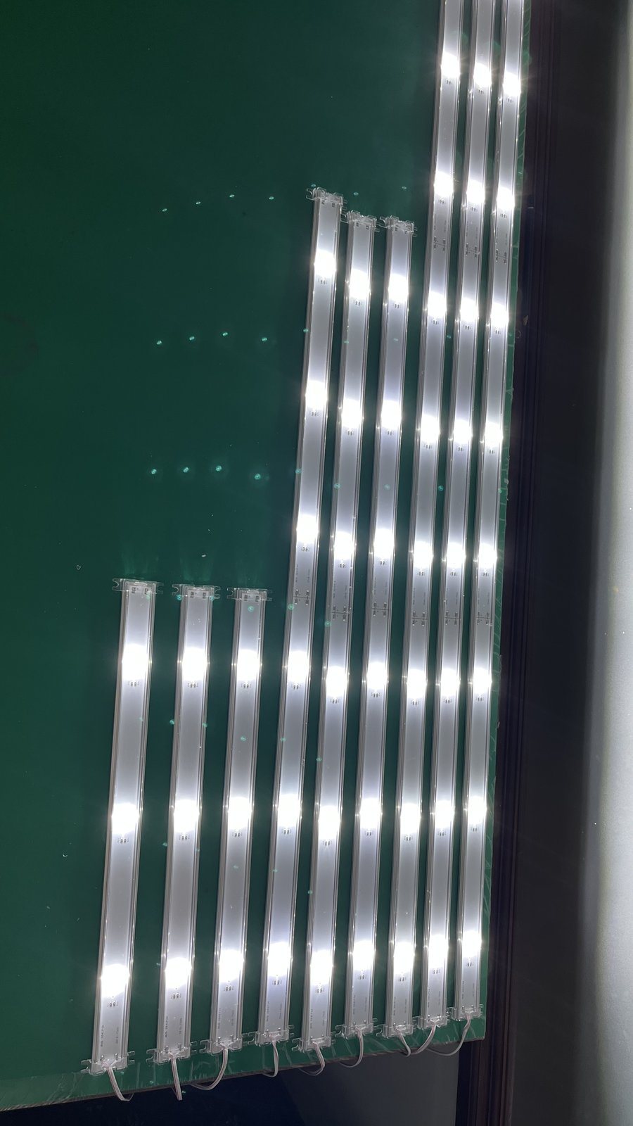 Lens strip installed inside signage (open casing view)