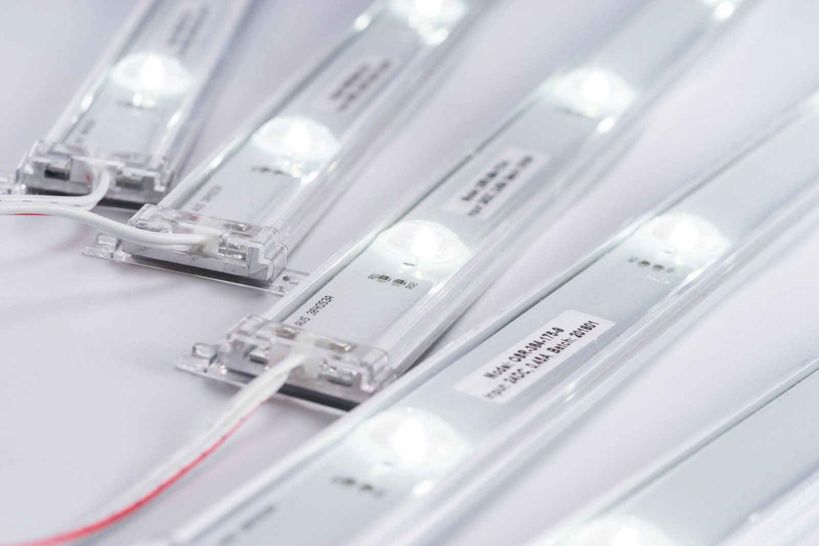 Lens strip close-up showing the 3-LED module segments — the strip cuts cleanly at the joint between segments